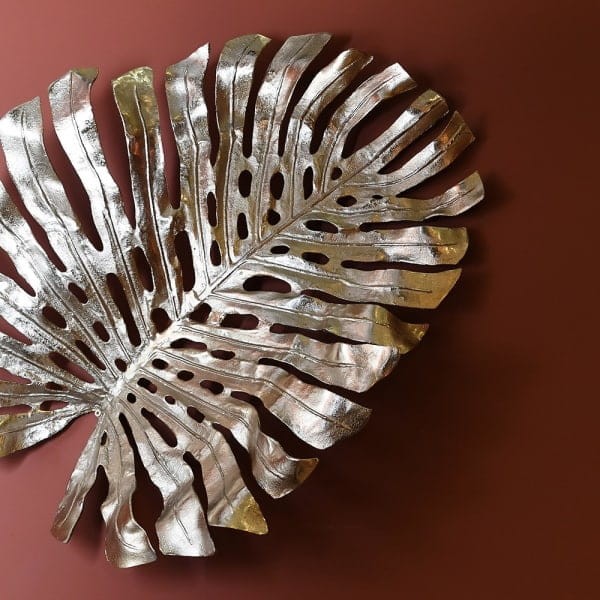 Złota ozdoba na ścianę w kształcie liścia monstery