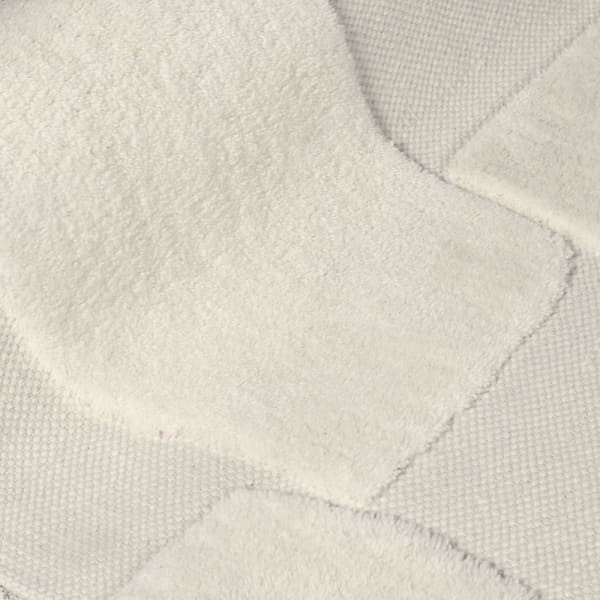 Tekstura dywanu Lyall Ecru – naturalna wełna i bawełna z efektem 3D