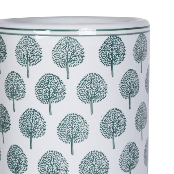 Zielony ornament przedstawiający drzewa na białej ceramice parasolnika Richmond